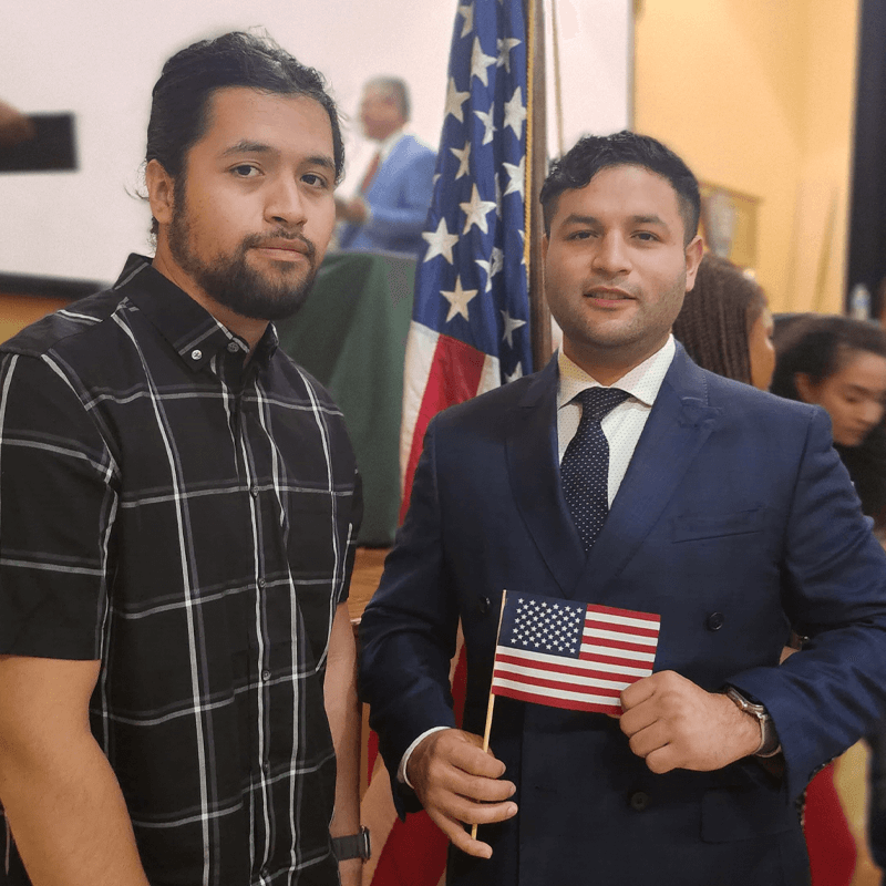 Two community members celebrating at their naturalization ceremony.